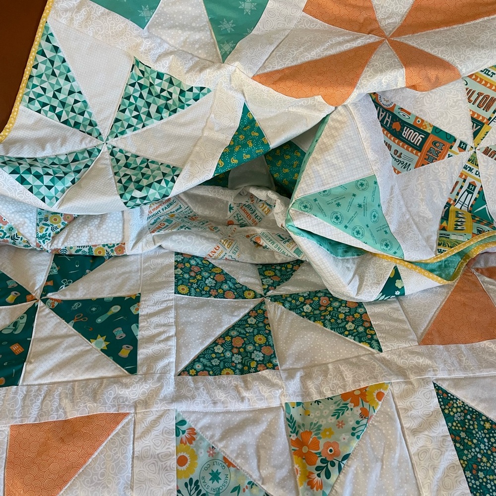Handmade pinwheel quilt throw